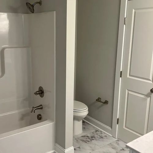 Full bathroom with tub and shower