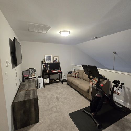 Upstairs bonus room with desk and seating